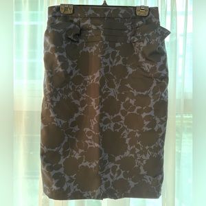 Women’s black and blue floral pencil skirt with pockets.